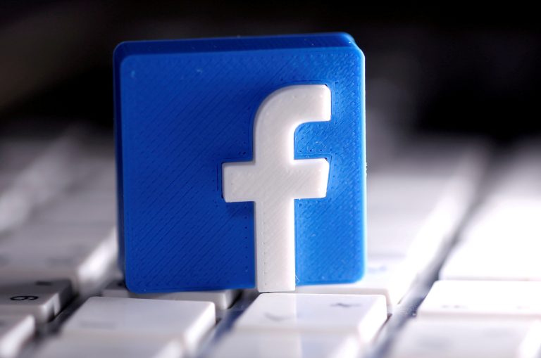 FILE PHOTO: A 3D-printed Facebook logo is seen placed on a keyboard in this illustration