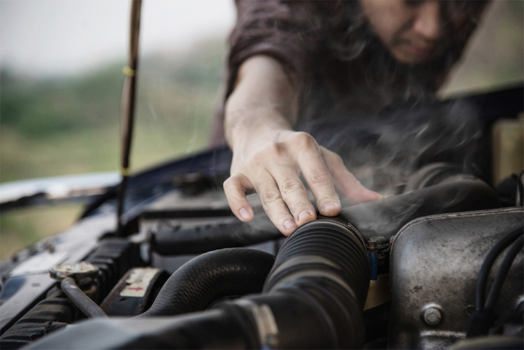 man-try-fix-car-engine-problem-local-road1