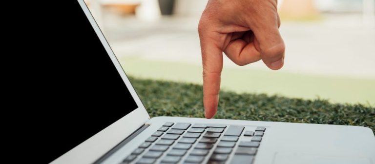 finger-pointing-laptop-keyboard-e1709621963435